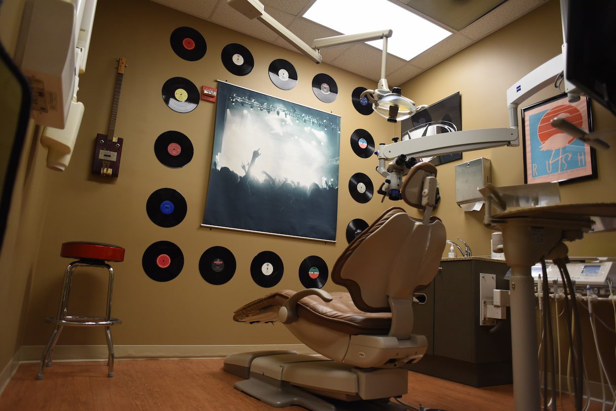 Dental chair with rock memorabilia on the wall