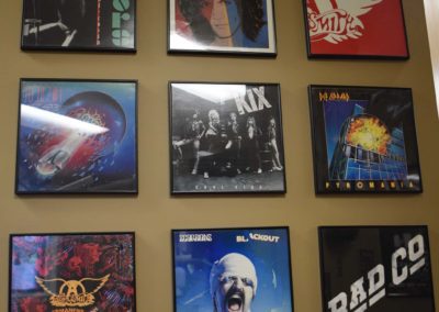 rock albums hanging on a wall